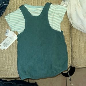 baby romper it’s a green romper with a strip tee under for 12 months